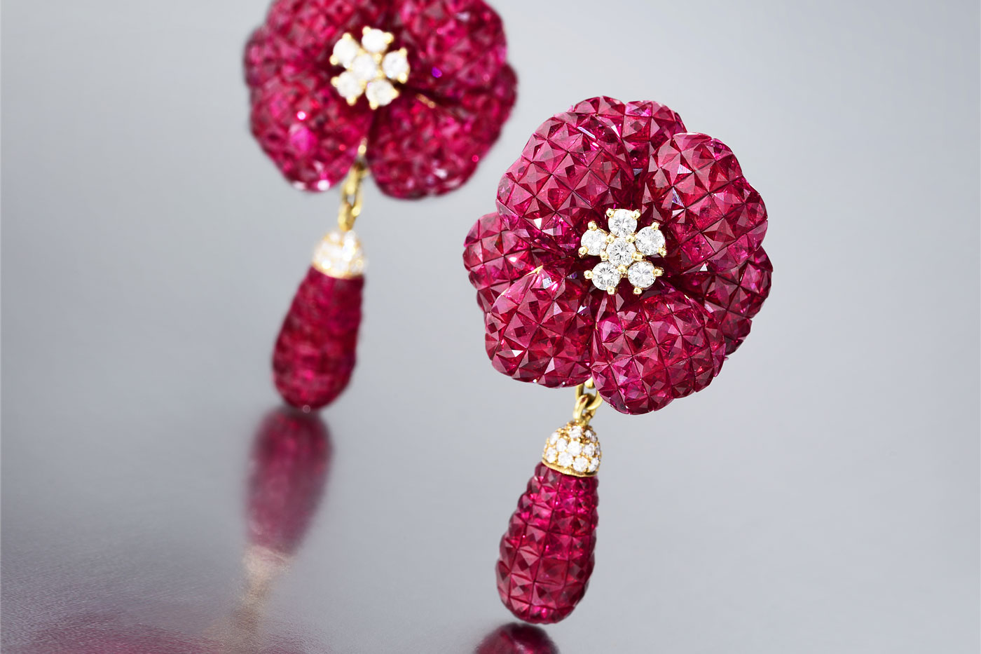 Invisibly set ruby earrings