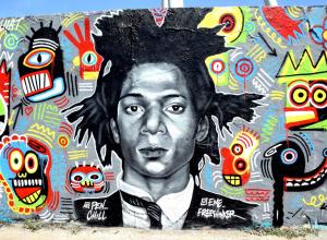 Graffiti of Jean-Michel Basquiat by Eme Freethinker and Pen Chill in Berlin. WikiCommons.