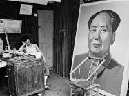 A painter naps at a craft art store specializing in ideological portraits, Chengdu, Sichuan province, 1980.