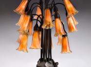 Tiffany Glass & Decorating Company, Eighteen-light Lily Table Lamp, prior to 1902, bronze, blown glass.