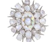 moonstone brooch in the shape of an oval with star points