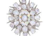 moonstone brooch in the shape of an oval with star points