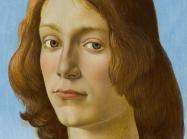 close up of the face of a Botticelli portrait of a young man with shoulder-length strawberry blonde hair