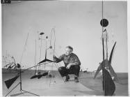 Publicity photograph of Calder during the installation of Alexander Calder. black and white
