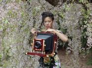 photo of Deana Lawson with a large-format camera