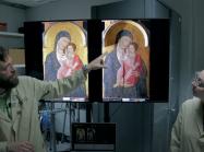 two scientists look at two paintings on computer screen