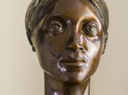 bronze bust of woman's head