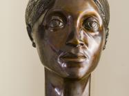 bronze bust of woman's head