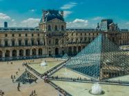 the louvre courtyard with pyramid and crowds