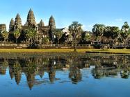 Angkor Wat temple makes up skyline beyond body of water 