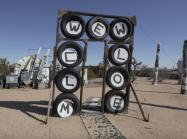 Welcome sign made of tires at the Purifoy Outdoor museum