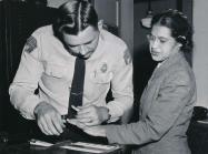 Parks being fingerprinted by Deputy Sheriff D.H. Lackey after being arrested on February 22, 1956, during the Montgomery bus boycott.jpg - Restoration (JPEG)
