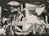 Picasso's Guernica painting in black and white with animals and people crying out in agony