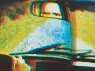 printed image of eyes in a rearview mirror