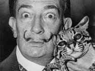Salvador Dalí holding his pet ocelot, Babou