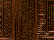 Detail of carved chest, showing two knobs