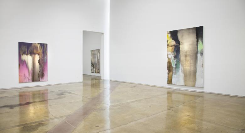 Installation view of Nir Hod: The Life We Left Behind at Kohn Gallery, Los Angeles. A large white room with large iridescent canvases 