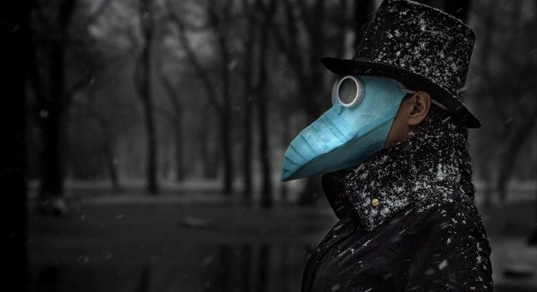 man in black plague bird mask