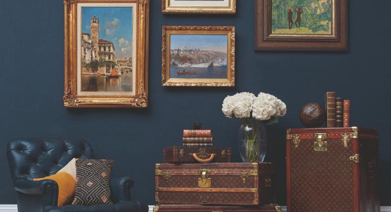travel trunks and paintings