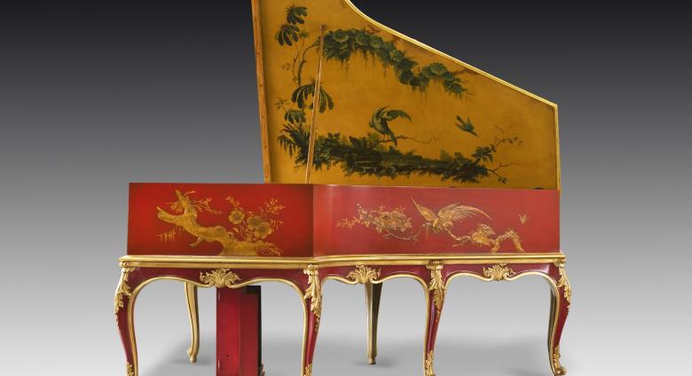 Red and yellow base with intricate, scrolling details in gold and green adorn this Auto Pleyela in a Chinoiserie Louis XV case. 