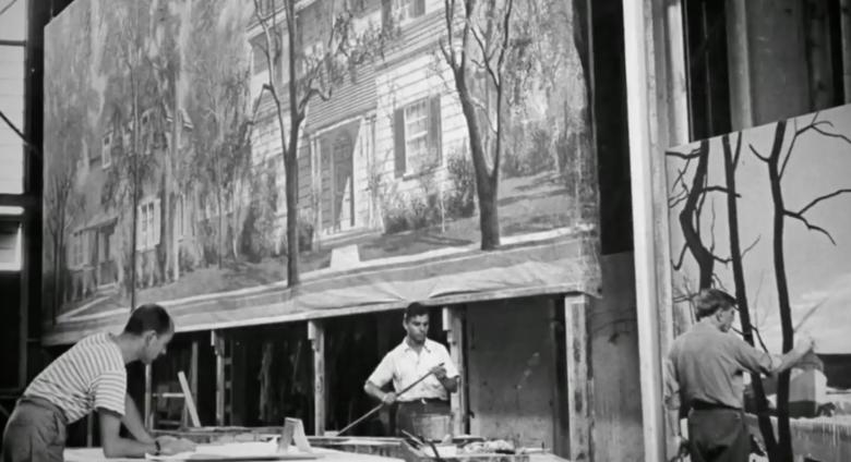 Men work on move backdrop, black and white image
