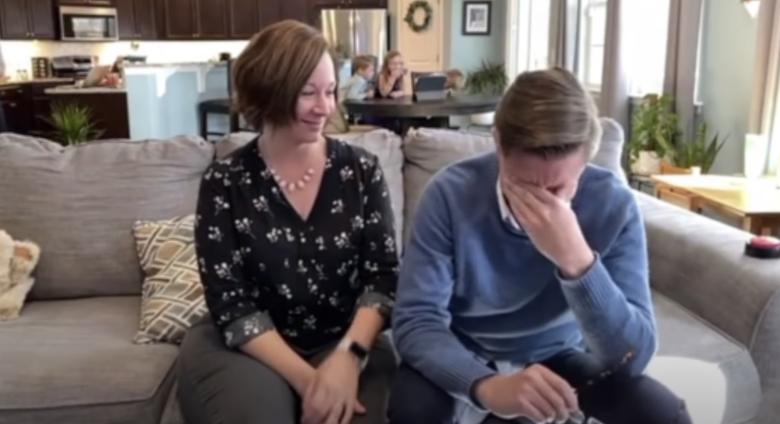 Beeple on couch with woman, he is in disbelief