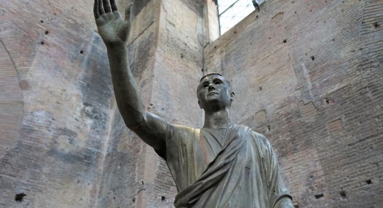 A bronze statue of a Roman magistrate in a toga, known at the _Arringatore_. From the 2nd century BC, Perugia