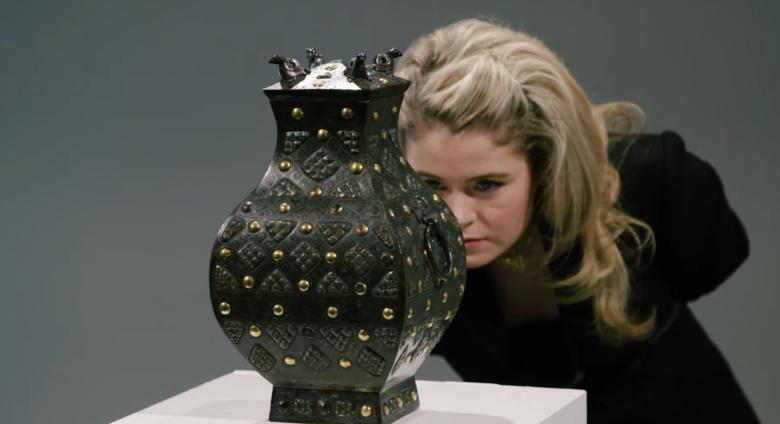 Expert looks at bronze vessel 