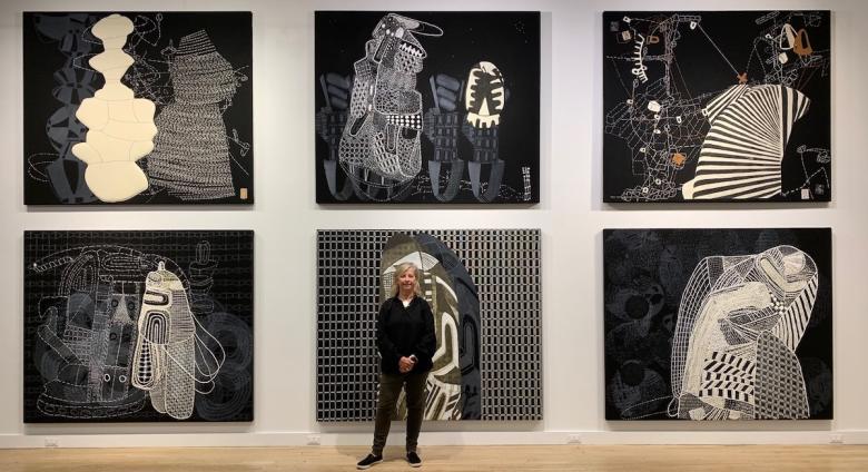 Sarah Amos in front of "Sarah Amos: Chalk Lines" at CUE Art Foundation
