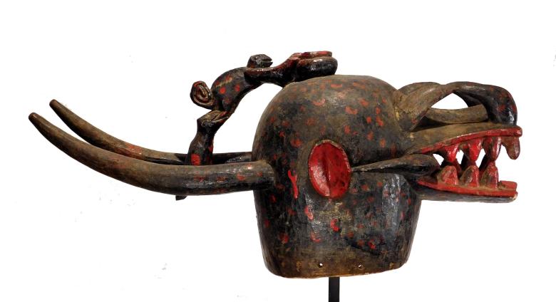 wooden sculpture of an animal skull