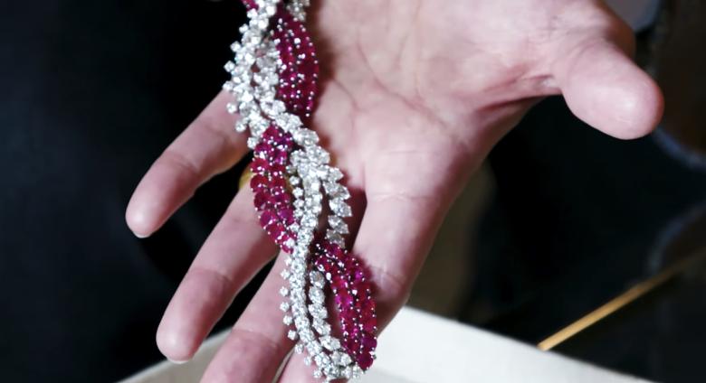 A piece of jewelry is shown in an open palm