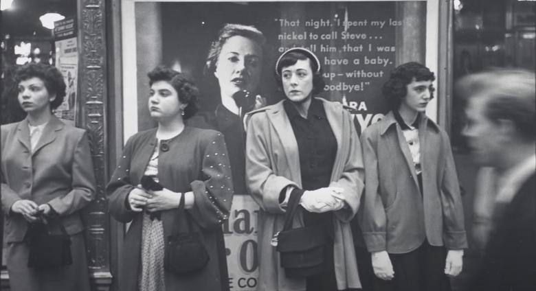 women waiting on the street
