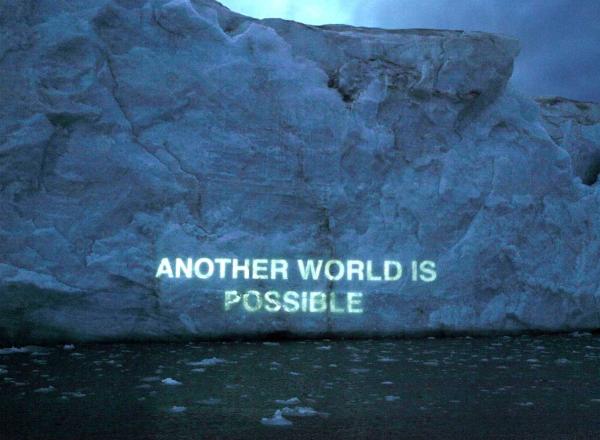Another World is Possible, Ice Text projection, David Buckland.