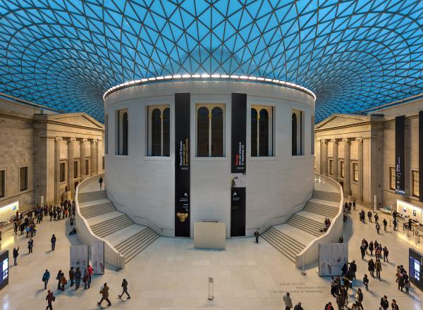 An ultra-wide rectilinear stitched panorama of the Great Court of the British Museum in London, United Kingdom.