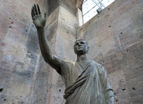 A bronze statue of a Roman magistrate in a toga, known at the _Arringatore_. From the 2nd century BC, Perugia