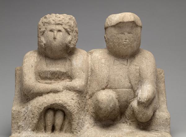 Edmonson, Bess and Joe, 1930-40. A a simple, stone sculpture of a couple sitting together, looking ahead. 