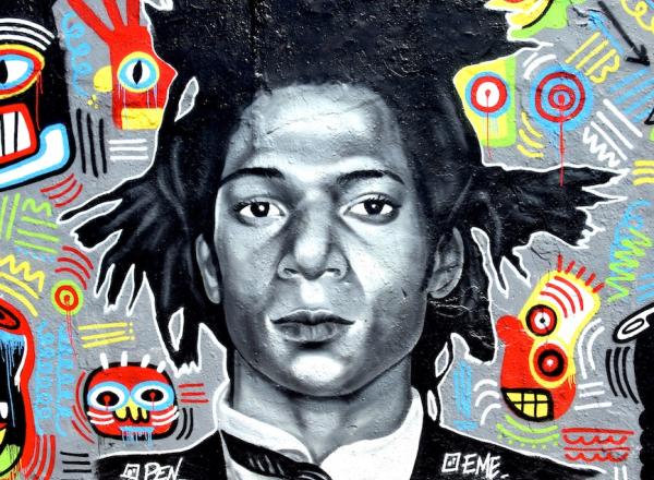 Graffiti of Jean-Michel Basquiat by Eme Freethinker and Pen Chill in Berlin. WikiCommons.