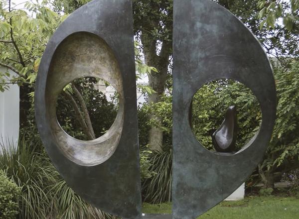 View of "Two Forms (Divided Circle)" in garden at Hepworth Museum