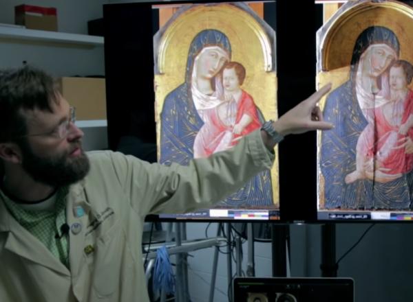 two scientists look at two paintings on computer screen
