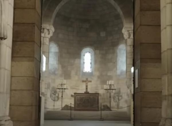 interior met cloisters, view down hall with sculptures 