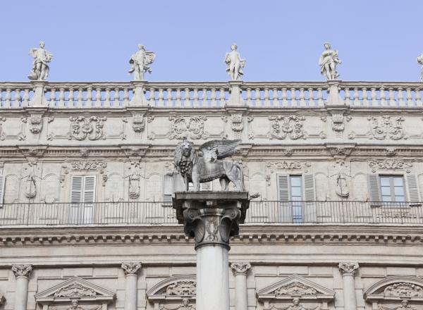 Facade of the Palazzo Maffei, a lion atop a pillar