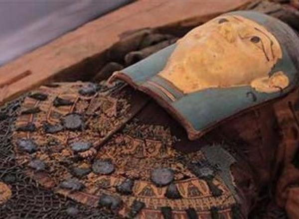 One of the mummies within a sarcophagus recently excavated from the newly discovered cemetery at Tuna al-Gebel in central Egypt.