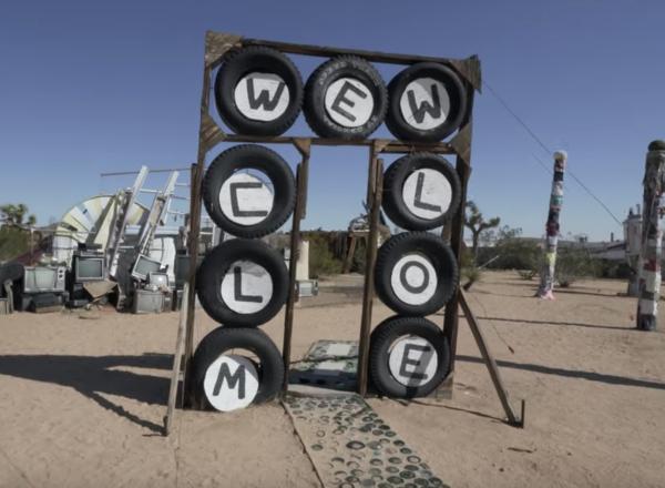 Welcome sign made of tires at the Purifoy Outdoor museum