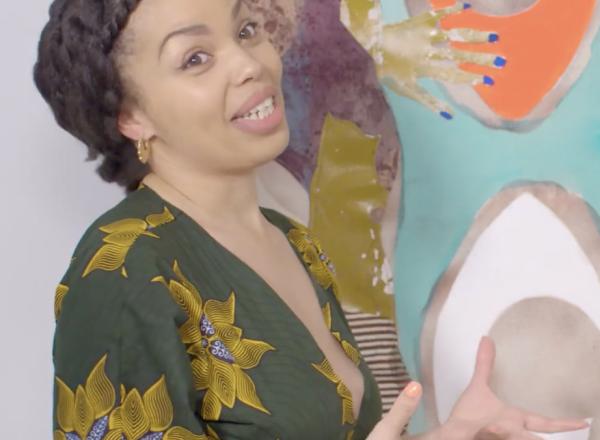 Emma Dabiri talks in front of painting