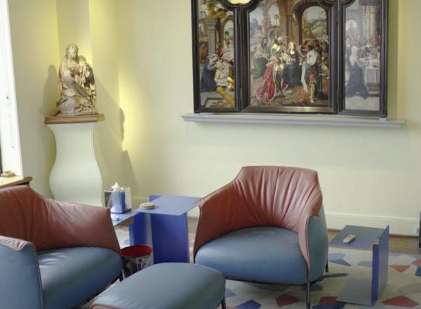 Room with renaissance altarpiece, renaissance sculpture, and modern furniture