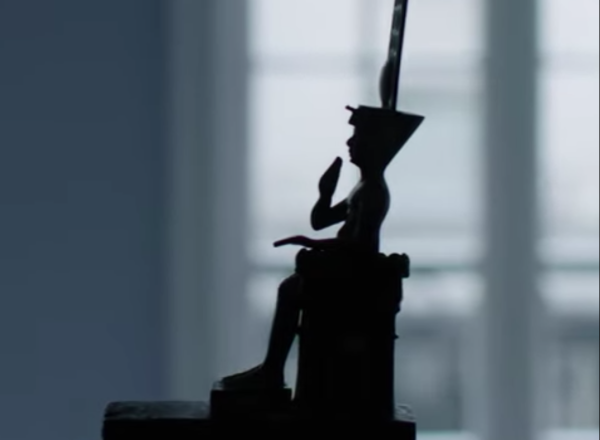 Silhouette of seated Egyptian bronze   