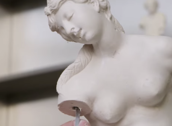 Worker making plaster cast