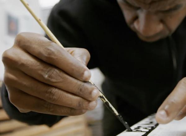 Marlon Mullen at work on painting
