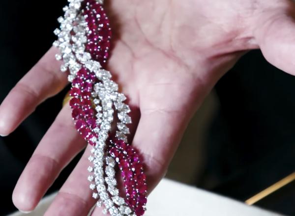 A piece of jewelry is shown in an open palm