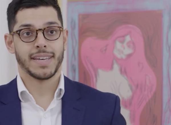 James Baskerville in front of prints